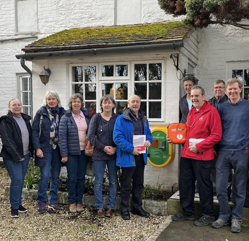 A defibrillator being handed over to community representatives at The Lord Nelson pub in Brightwell Baldwin