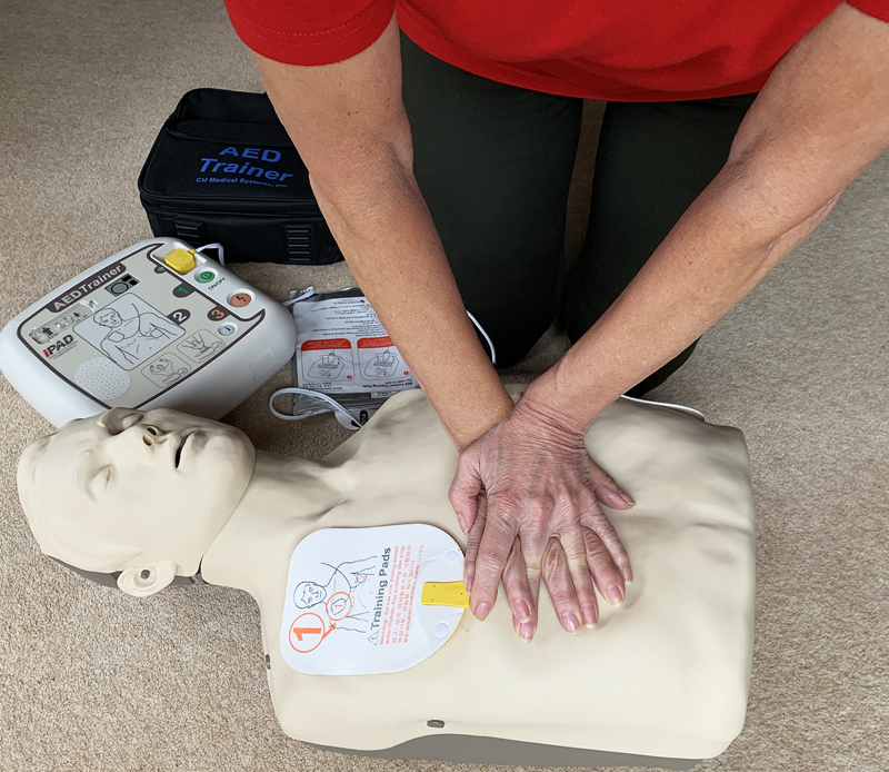 A member of the Thames Valley Heartbeat team demonstrating CPR on a dummy