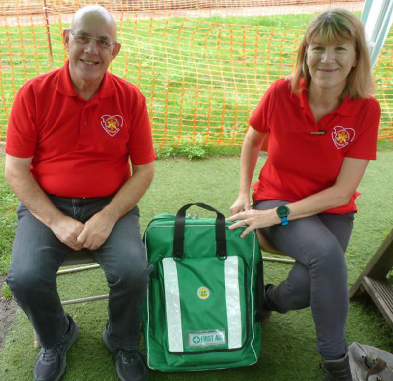 Some of our first aiders at an event, wearing their red Thames Valley Heartbeat jumpers