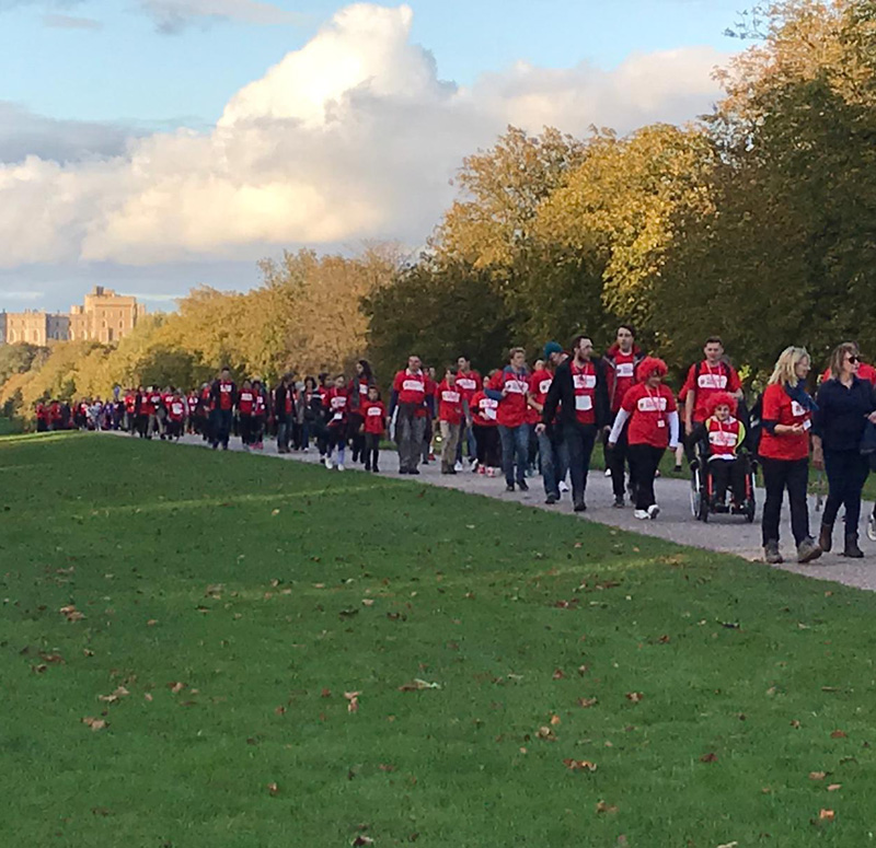 Participants of a sponsored walk, with Windsor Castle in the background